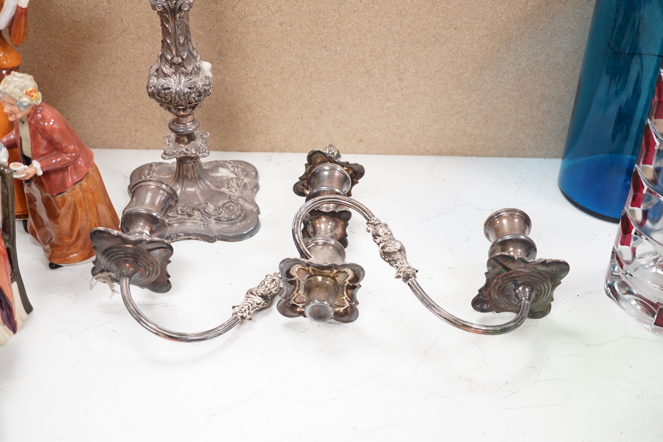 A silver plated entree dish and cover and a pair of three light candelabra, tallest 55cm